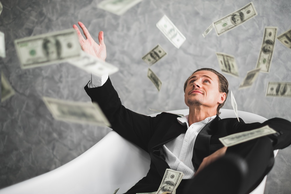 Businessman Throwing Money in the Air