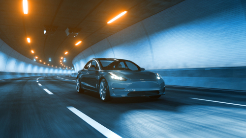 Modern Electric car rides trough tunnel