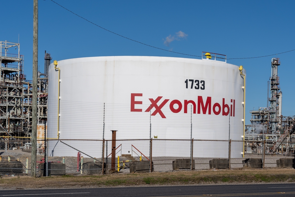 The ExxonMobil sign on the oil tank.