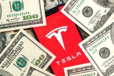Tesla car company stock market background.