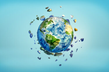 3d rendering of Earth globe getting crushed into small pieces with the cracked parts flying away.