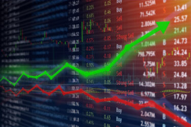 Investing and stock market concept gain and profits with faded candlestick charts