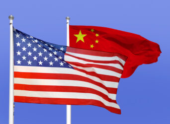 the flag of the United States of America and the flag of the Republic of China fly together on flag poles next to each other