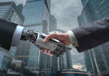 Business Human and Robot hands in handshake.