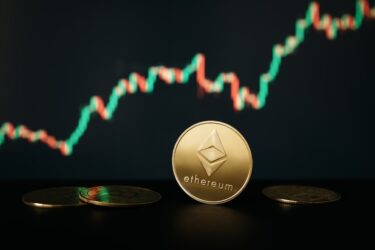 Ethereum coin against the background of the graph of price changes on the crypto exchange