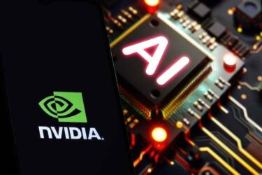 NVIDIA logo on phone and blurred AI chip