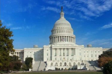 The United States of America capitol building on a sunny day.