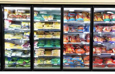 Frozen foods on shelves in a supermarket.