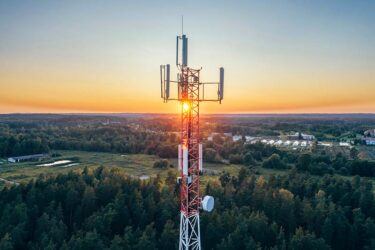 Mobile communication tower during sunset from above