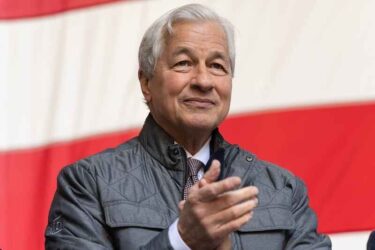 Jamie Dimon attends ceremony for final steel beam wrapped with American flag and signed by workers and officials raised at JP Morgan Chase new global headquarters in New York