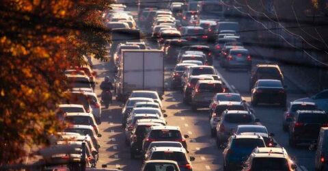 The daily grind of the morning commute is brought to life in this photo, depicting the frenzied pace of cars as they navigate the busy city streets.