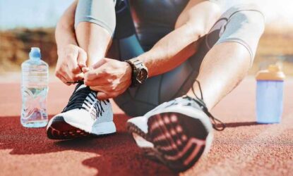 A young sportsman getting ready for athletic and fitness training outdoors.