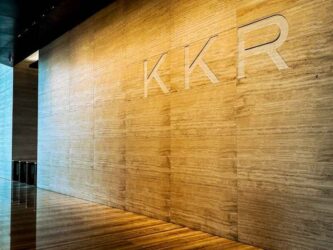 Signage for private equity firm KKR in the entrance lobby to 30 Hudson Yards, New York, USA
