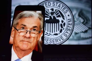 Jerome Powell on a smartphone