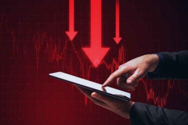 Man pointing at tablet with red arrows pointing down in the background